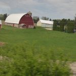 Red barns nearing Chicago where farms are smaller red barns